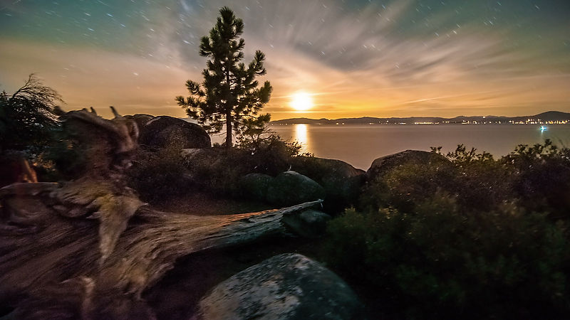 nimia_92152_Timelapse_dolly_shot_of_Lake_Tahoe_from_Sand_Harbor_Nevada_Desert_sunset_with_lens_flare_seen
